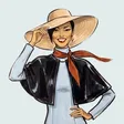 Sloane Carrick holding a straw sun hat